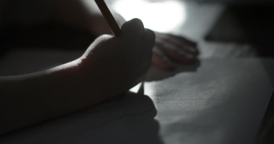 A child is drawing then starts erasing