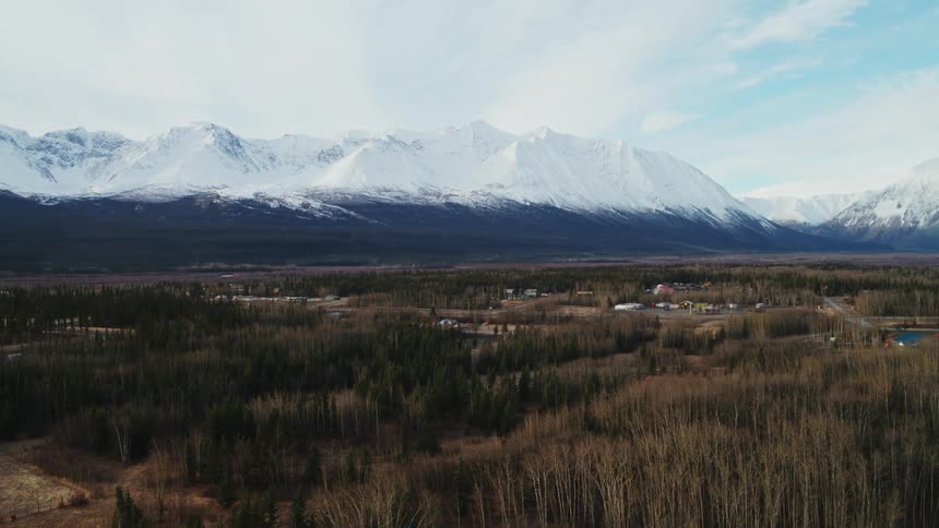 The mountains are covered with snow at their peak