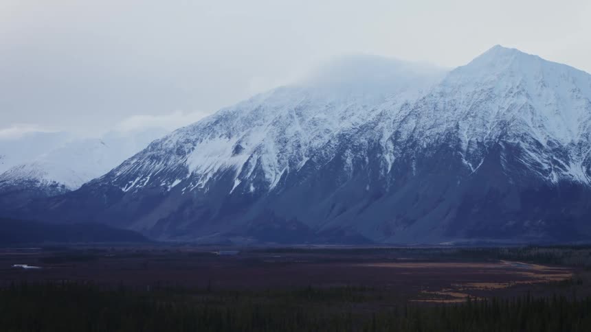 Aerial view of high snow capped mountains