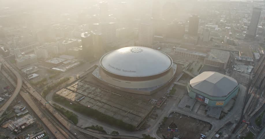 A 4K aerial shot of the iconic Superdome in Downtown New Orleans Louisiana during sunrise