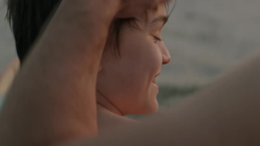 A father and son are on the beach