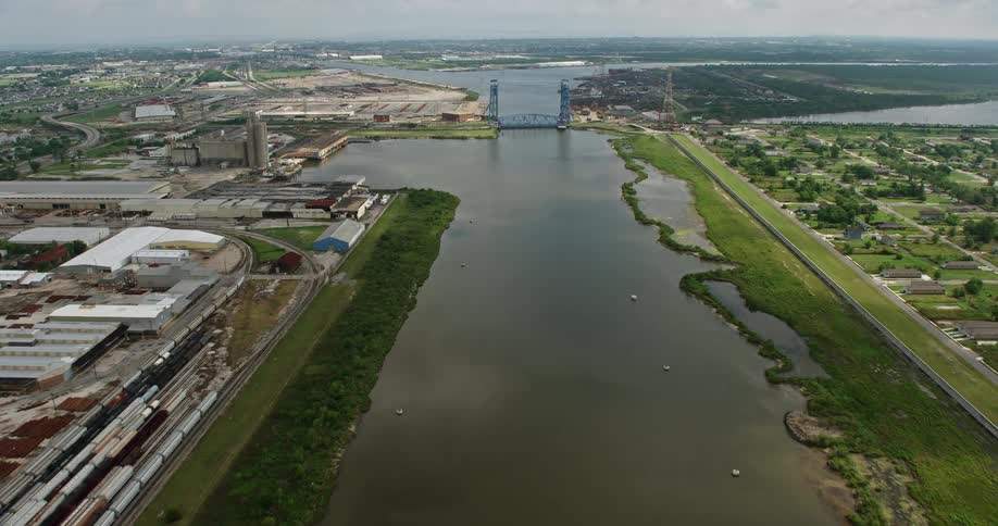 Aerial view of Industrial Canal as we approach toward the Florida Avenue Bridge on a partly cloudy day in New Orleans