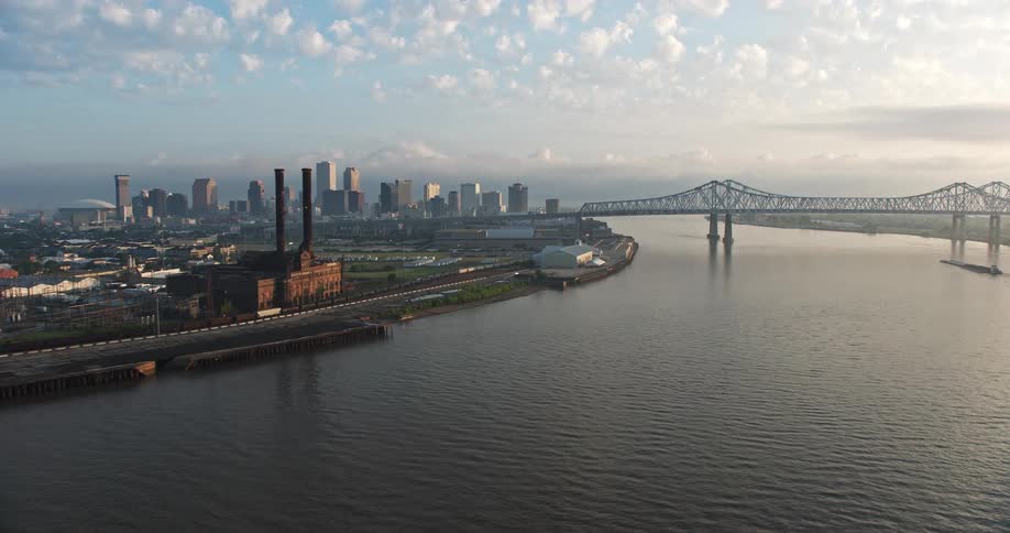 A stunning 4K aerial footage of Downtown New Orleans and the Crescent City Connection bridge over the Mississippi river during sunrise