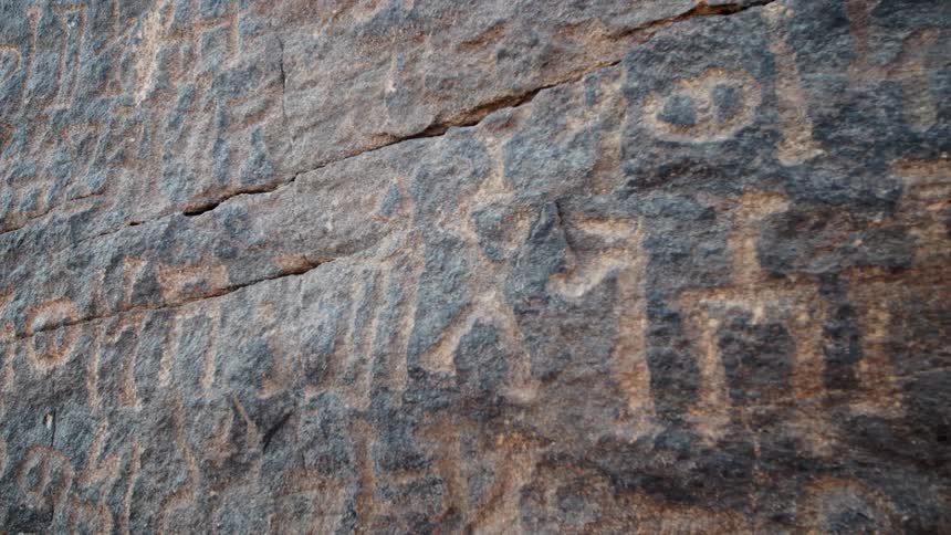 Ancient stone carvings on a rock in Saudi Arabia