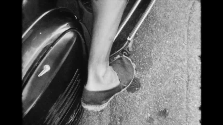 A close up of a persons foot pushing a motorcycle peddal