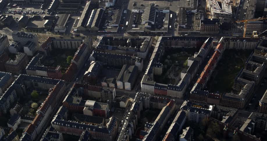 An aerial of city blocks with buildings at every intersection