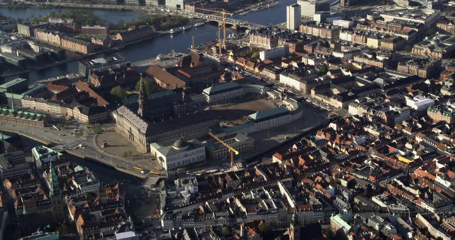 Traffic crosses bridge over river a short distance from cathedral