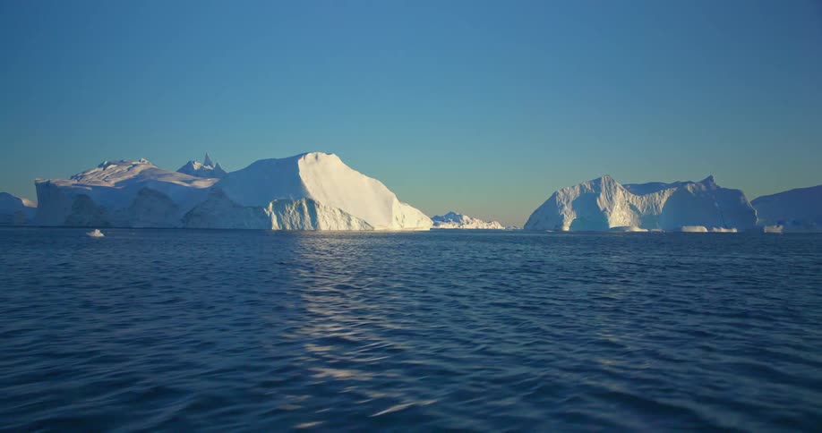 A time lapse of an aerial of large ice glaciers in the arctic ocean
