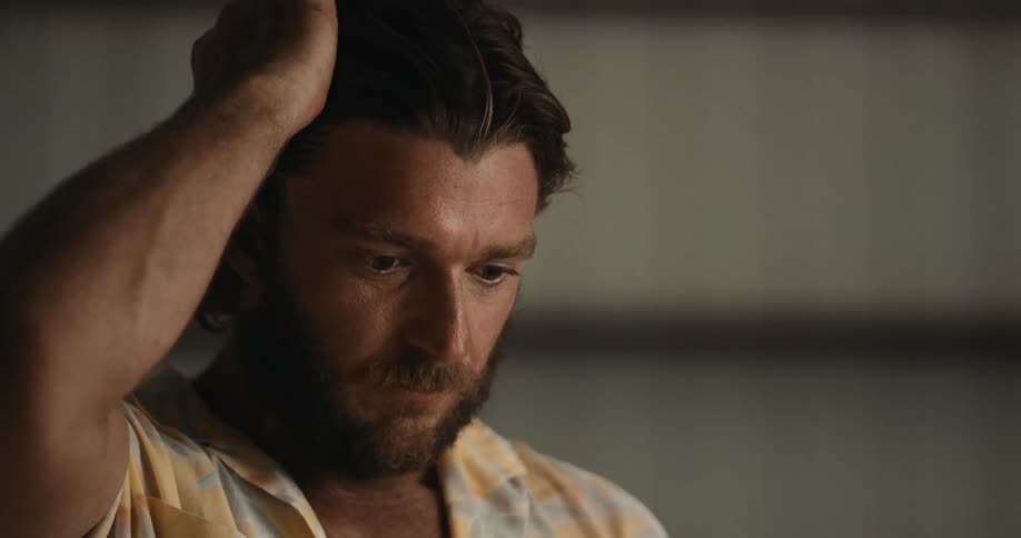 Portrait of a man thinking while standing in a room