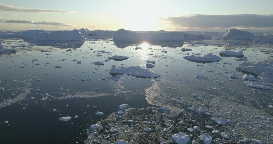 A large body of water is shown with melting polar ice caps all over it