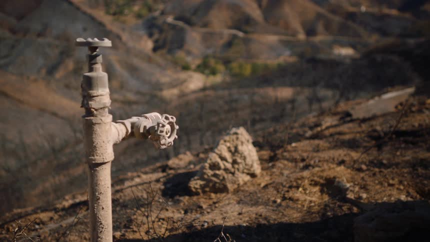 A water spout on a hill