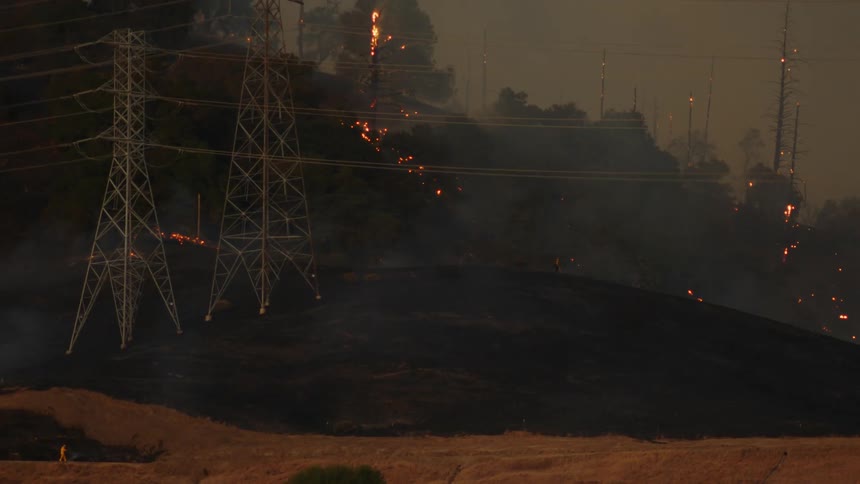 The hills are on fire by the power lines
