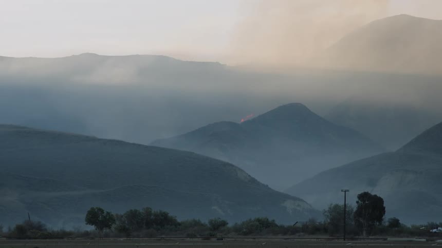 Fog hovering through the mountains in early morning