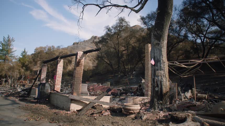 Remains of a house in the mountains destroyed by a wildfire