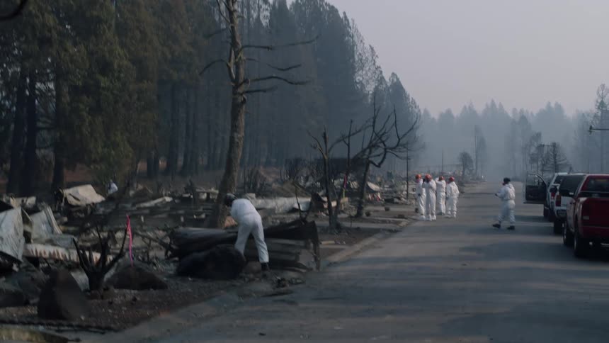 Workers begin clearing up after a fire