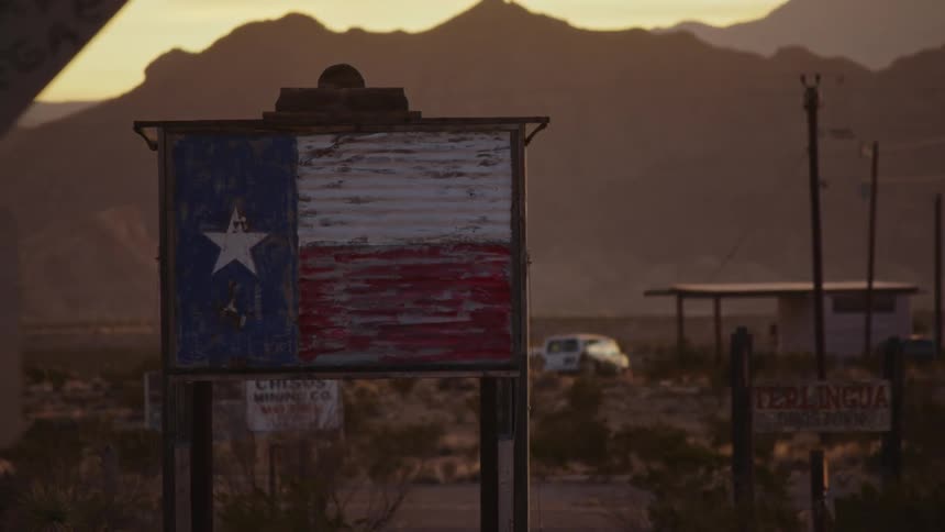 Rugged sign with Texas flag in Big Bend