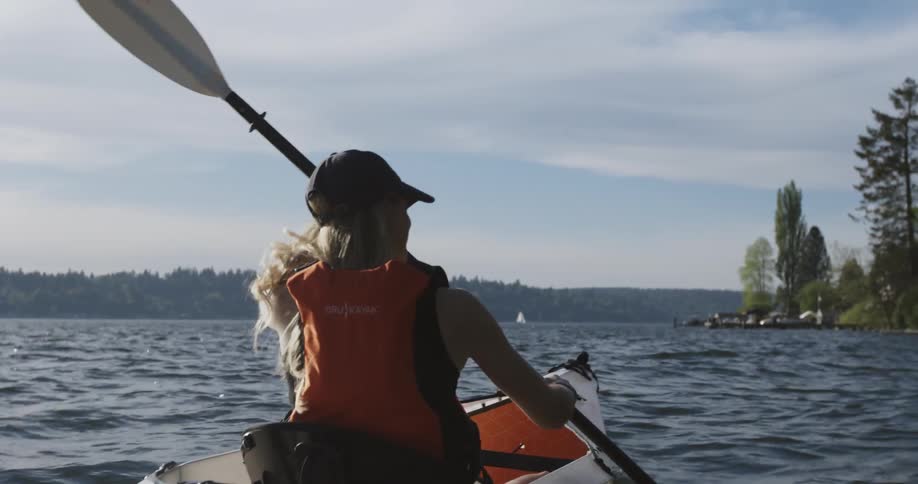 Woman kayaking on a large lake