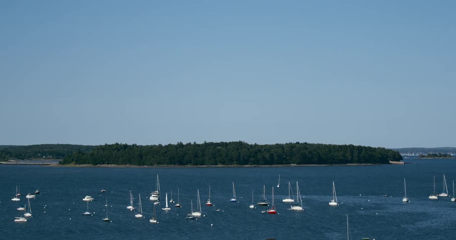 Yachts docked out in harbor in a tropical island