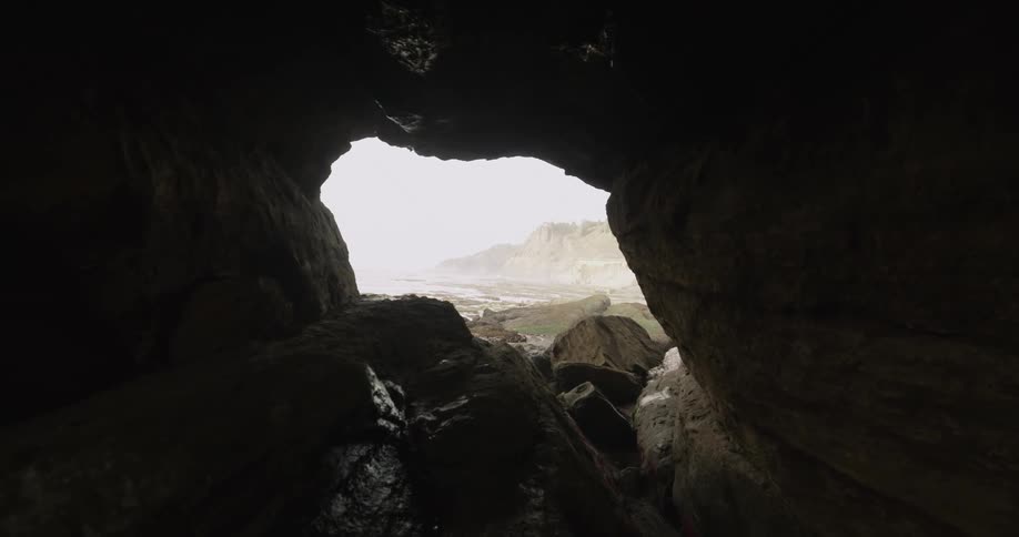 Looking out from inside of sea cave to the coast outside
