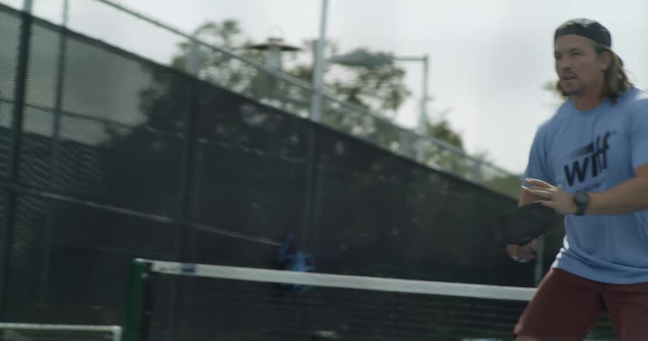 A man is playing tennis