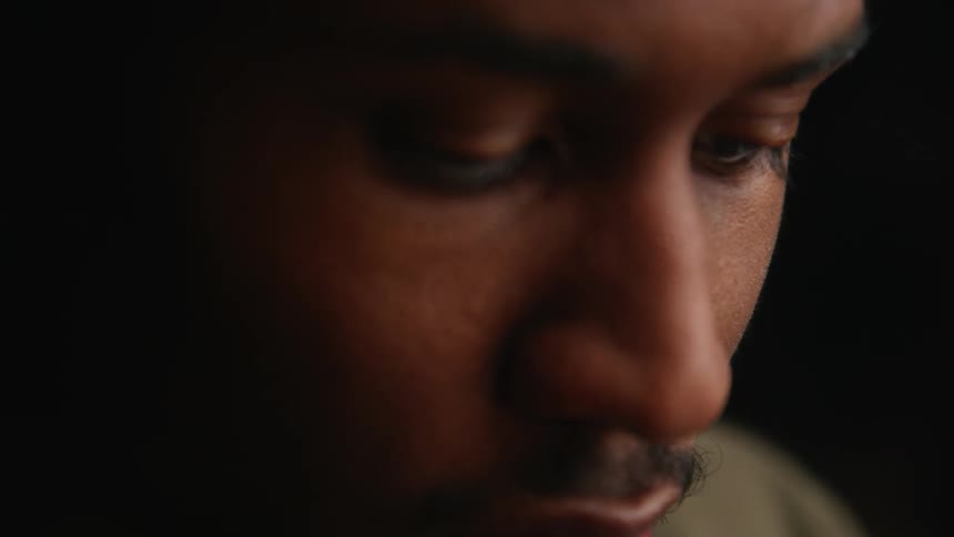 Close up of a mans face as he concentrates