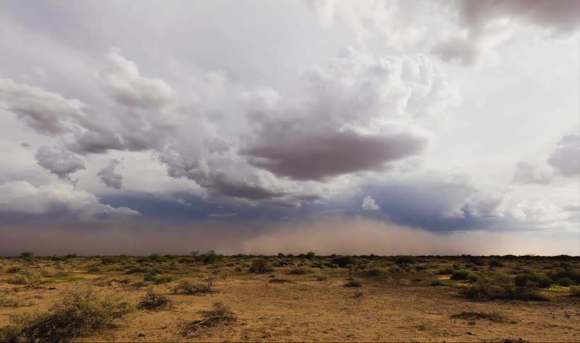 Time-lapse of a dust storm moving across the plain