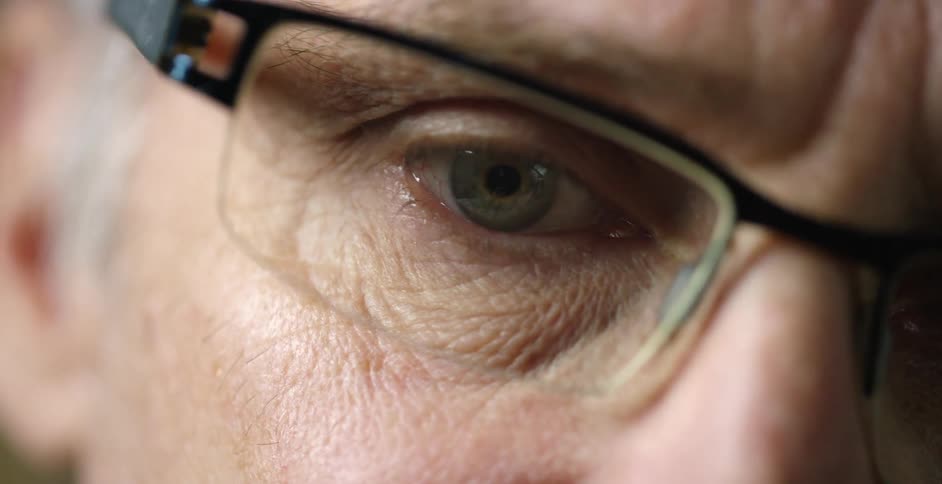 Extreme close-up of an elderly person wearing eyeglasses