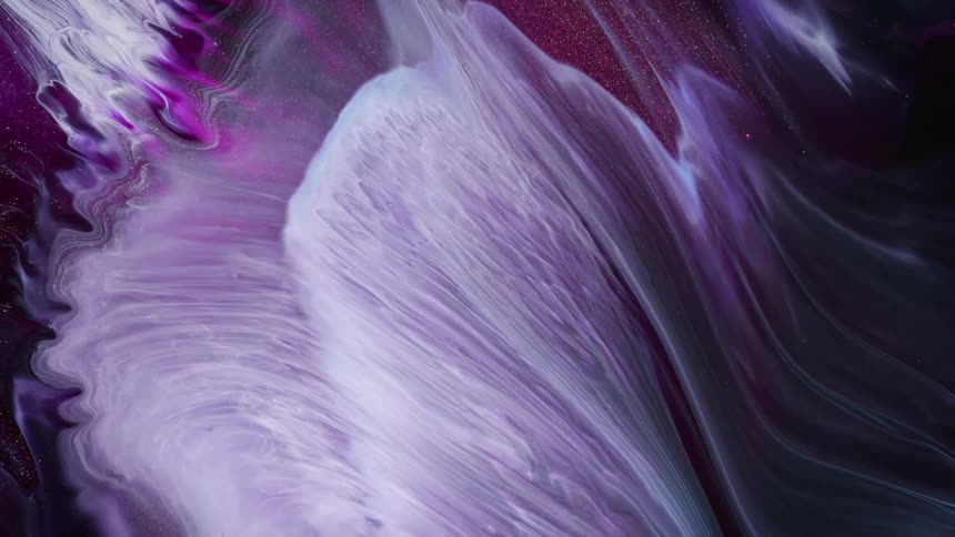 A white and purple cloud of colors cross the scene