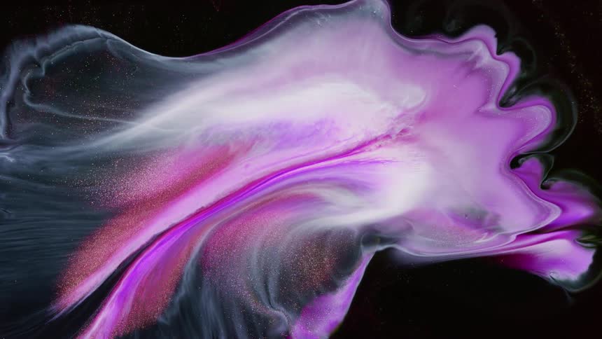 Abstract colors of purple white and sparkles against a black screen