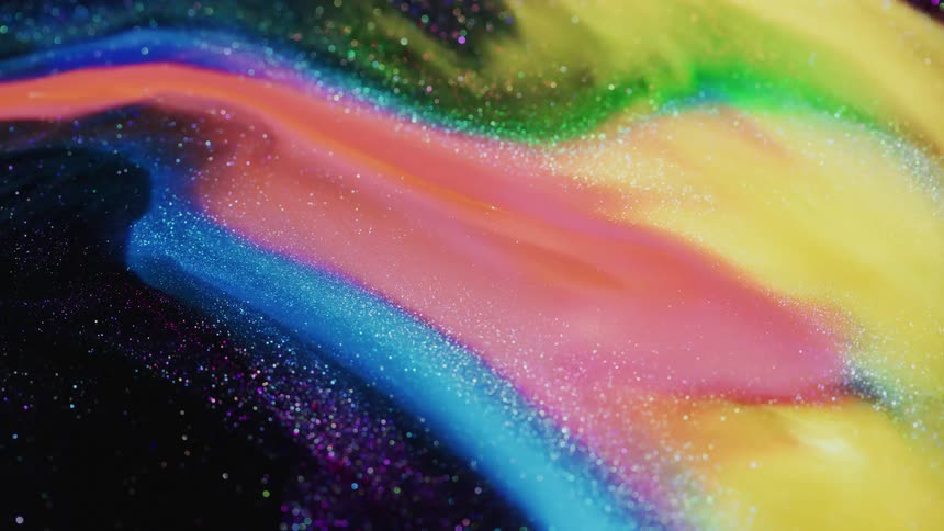 Colored stripes stretch across a dark glittery surface that sparkles as it moves