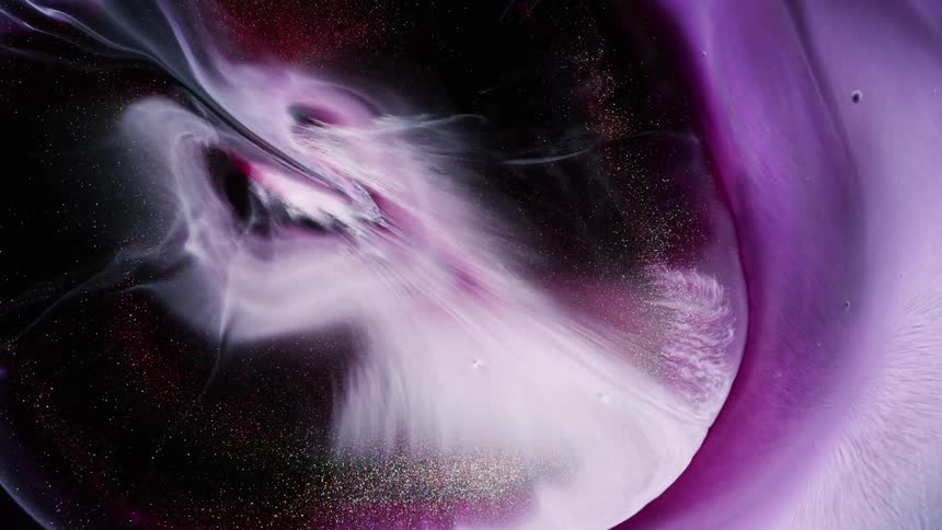 A wave of white nebula and golden glitter explodes in the night sky