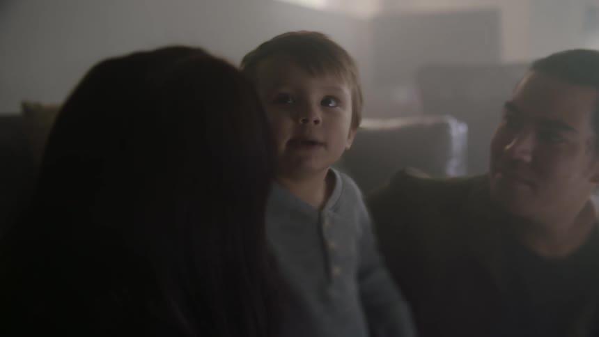 A child talks to his parents