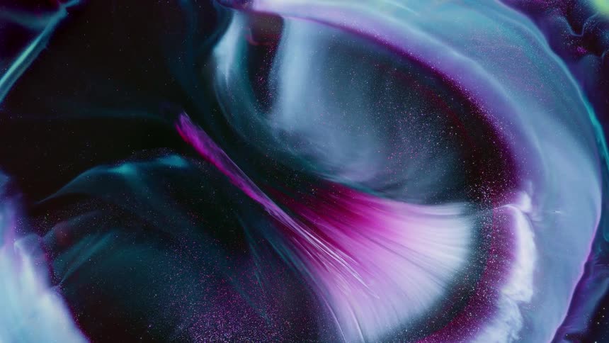 A rounded area pushes through the fiber inside an orb and sparkling particles spill inside as it grows and moves