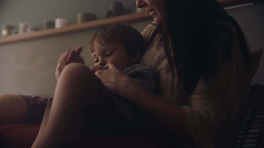 Mother and baby are playing around and having fun inside