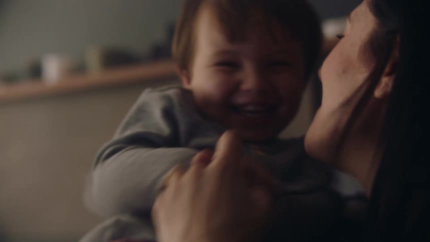 Mother and son are hanging out and laughing together