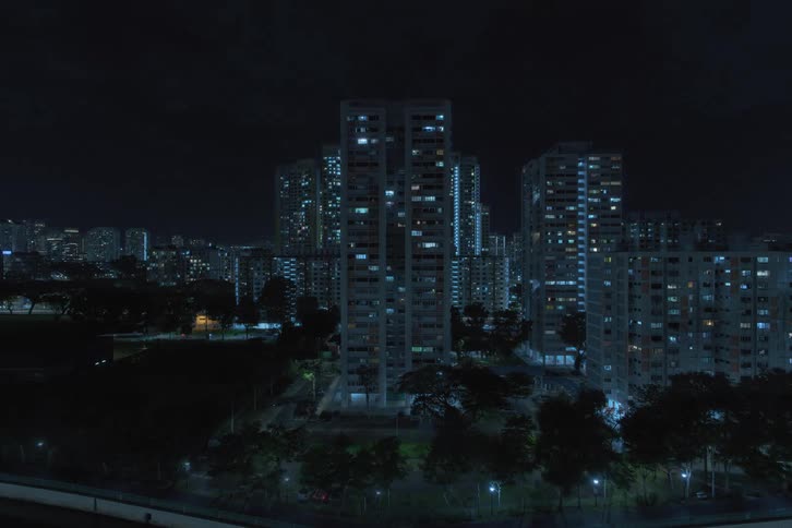 The window lights turn off in the city buildings