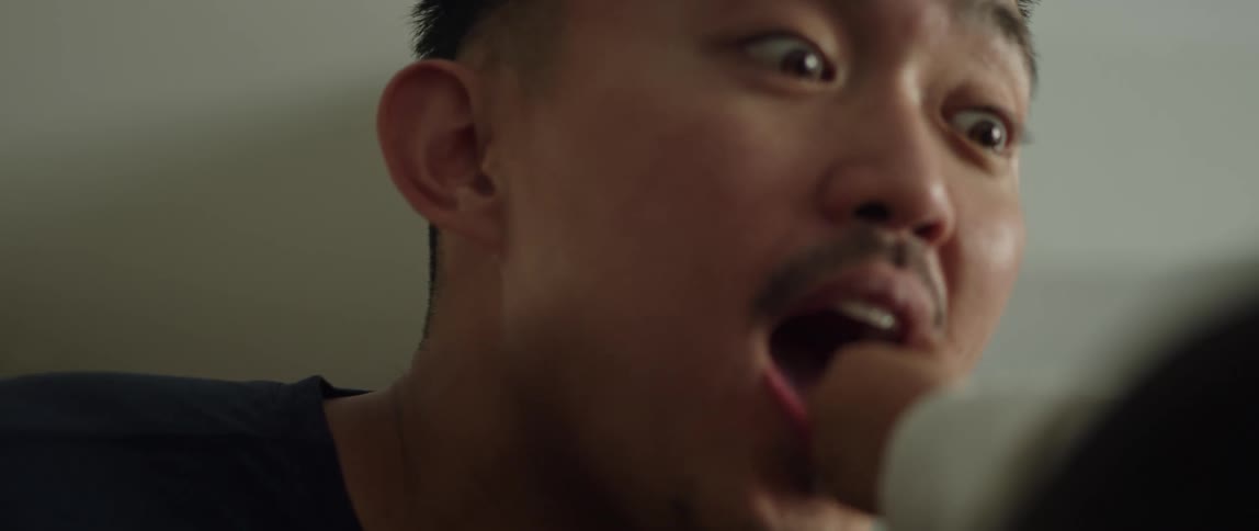 Daughter puts food in fathers mouth laughing