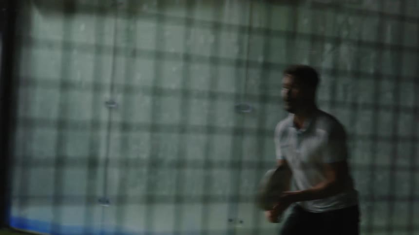 A man using a racket toplay tennis pumping hit fist in power