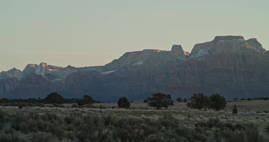 Snow coated plateau borders grasslands
