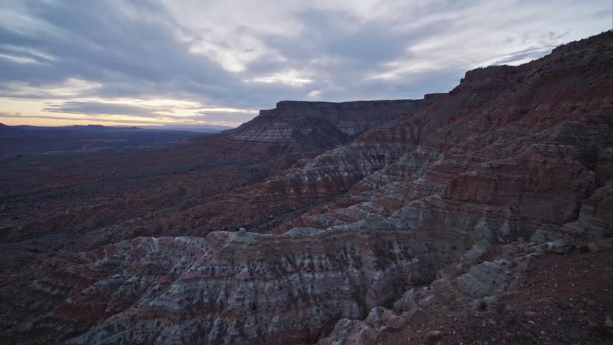 An aerial of desert mountain ranges with ridges leading to plateaus
