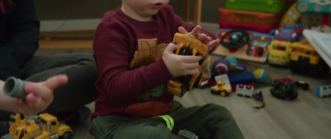 Kids are playing with toys inside around the day time