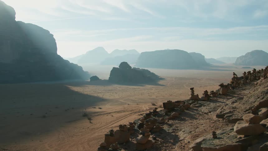 Desert and canyon with plateau and rock formations on edge wide horizon mountains