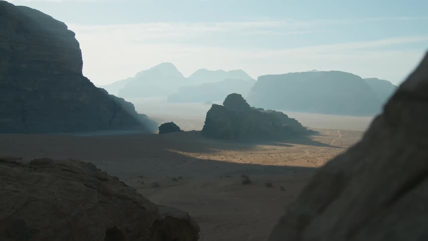 Panoramic view of mountain ranges in the desert under the morning mist