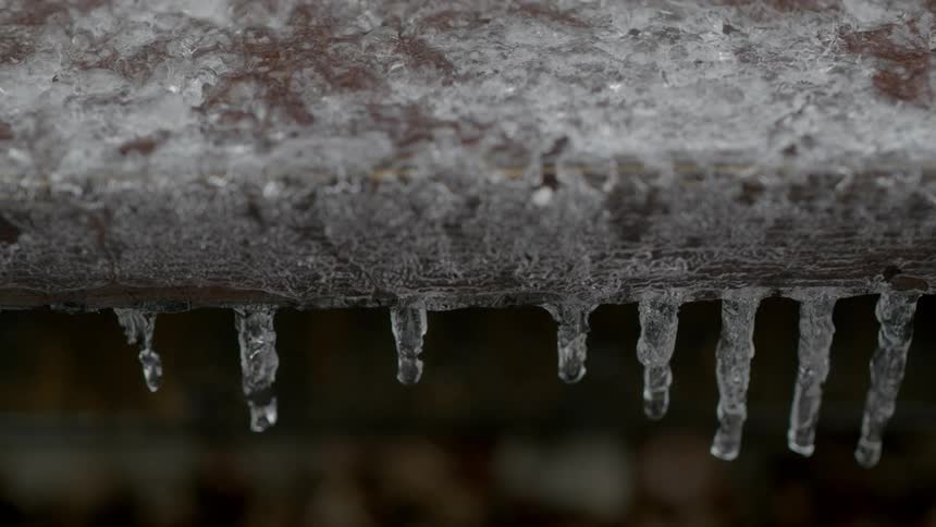 Water dripping off of icicles
