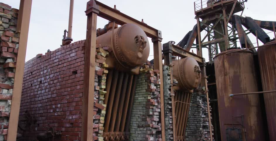 Rusty machinery on a cloudy day