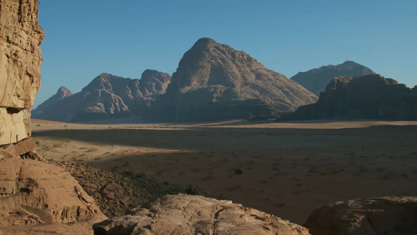 Panoramic view of a distant mountain range under a blue sky in the desert