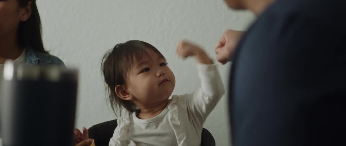 A father and daughter play at home
