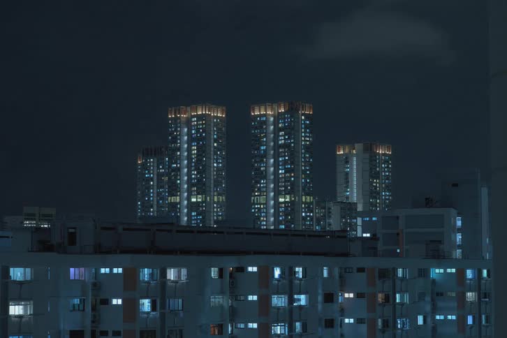 Time lapse of the night lights turning off on buildings in the city skyline