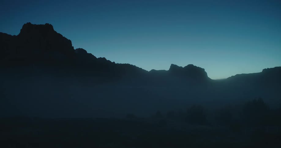 Morning mist blankets the foothills leading towards Zion National Park at dawn
