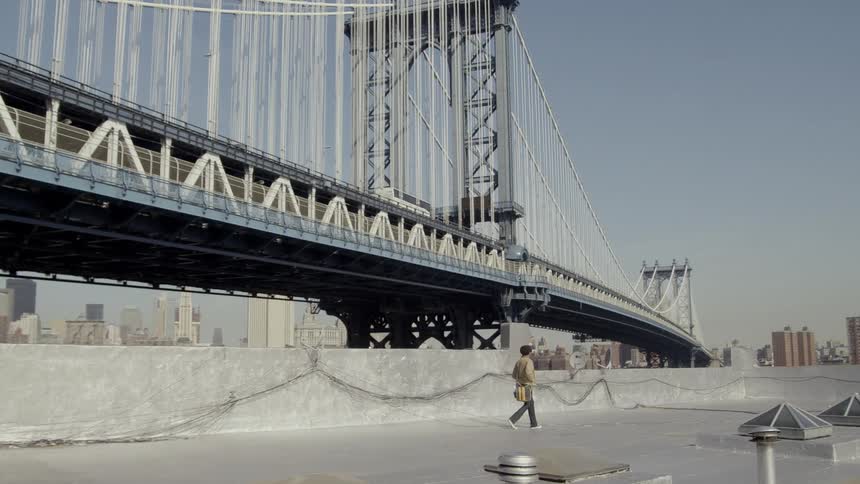 A person is walking outdoors around the city area